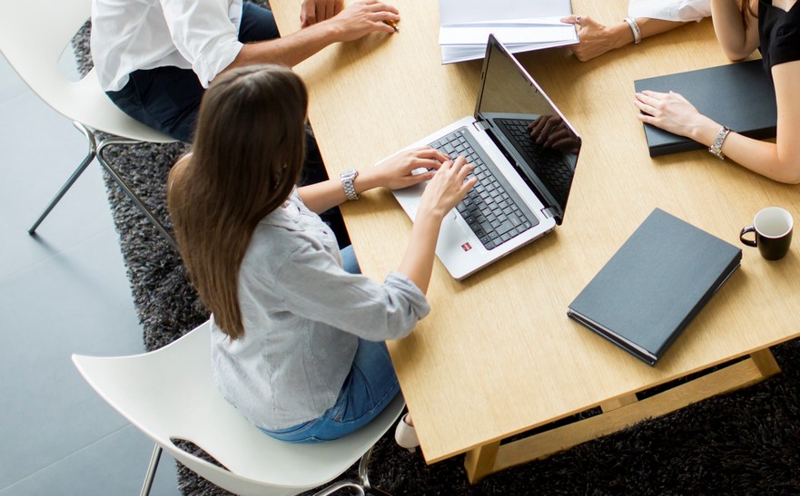 Successful group of business people working on plans